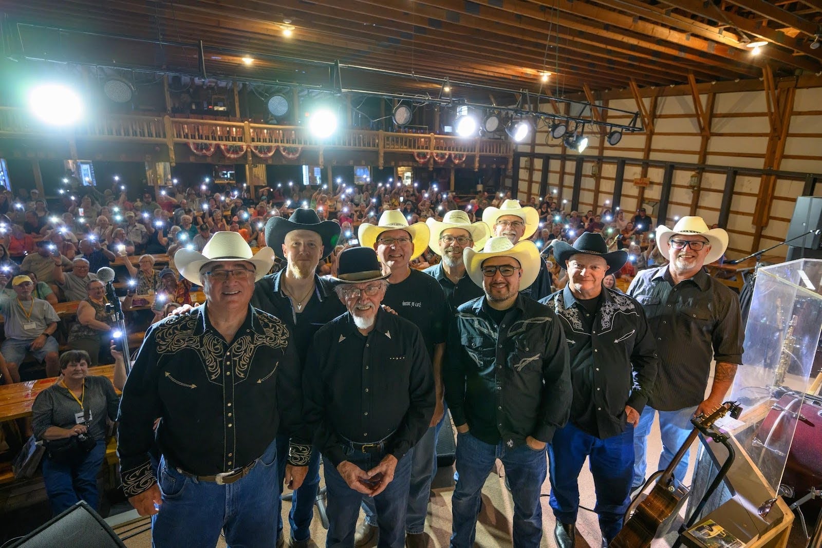 Cowboy musicians performing on stage