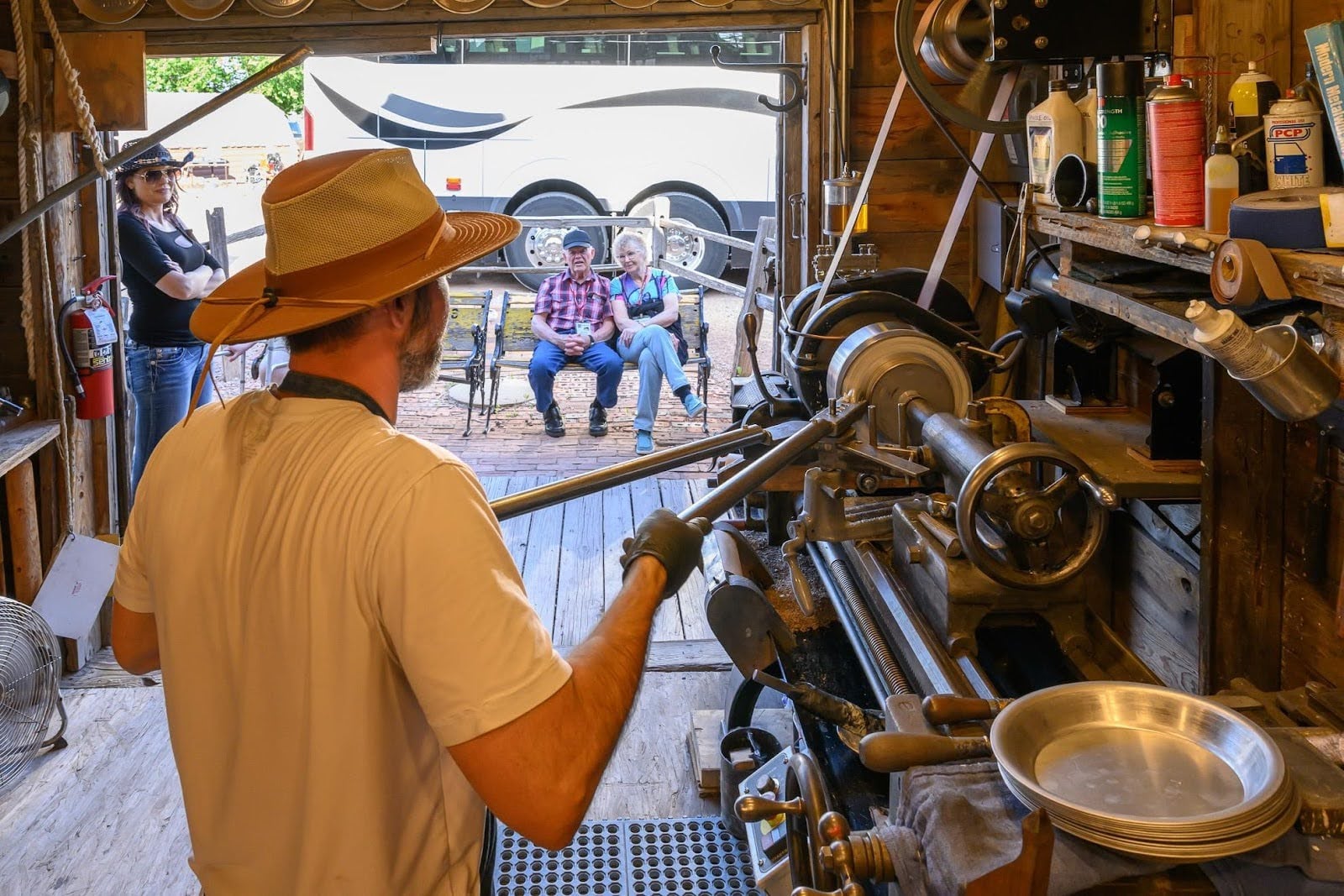 Crowd gathered around a scheduled blacksmith demo