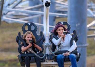 Family smiling as they shoot targets