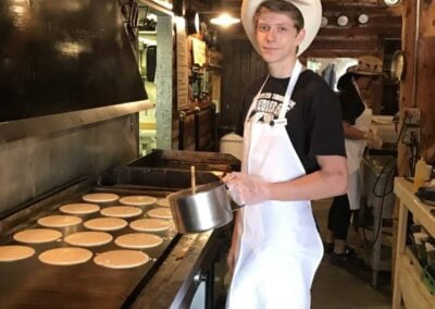 pancakes being cooked on a griddle